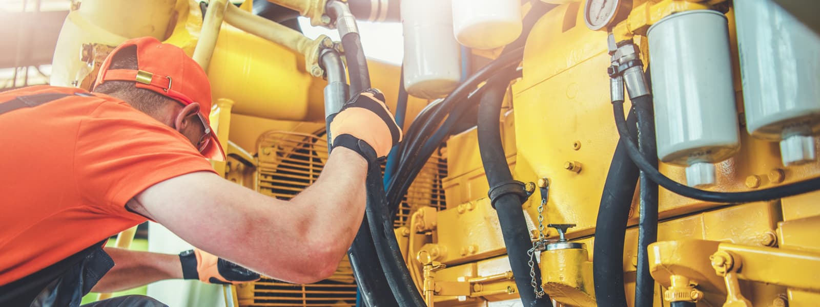 A mechanic working on a diesel engine