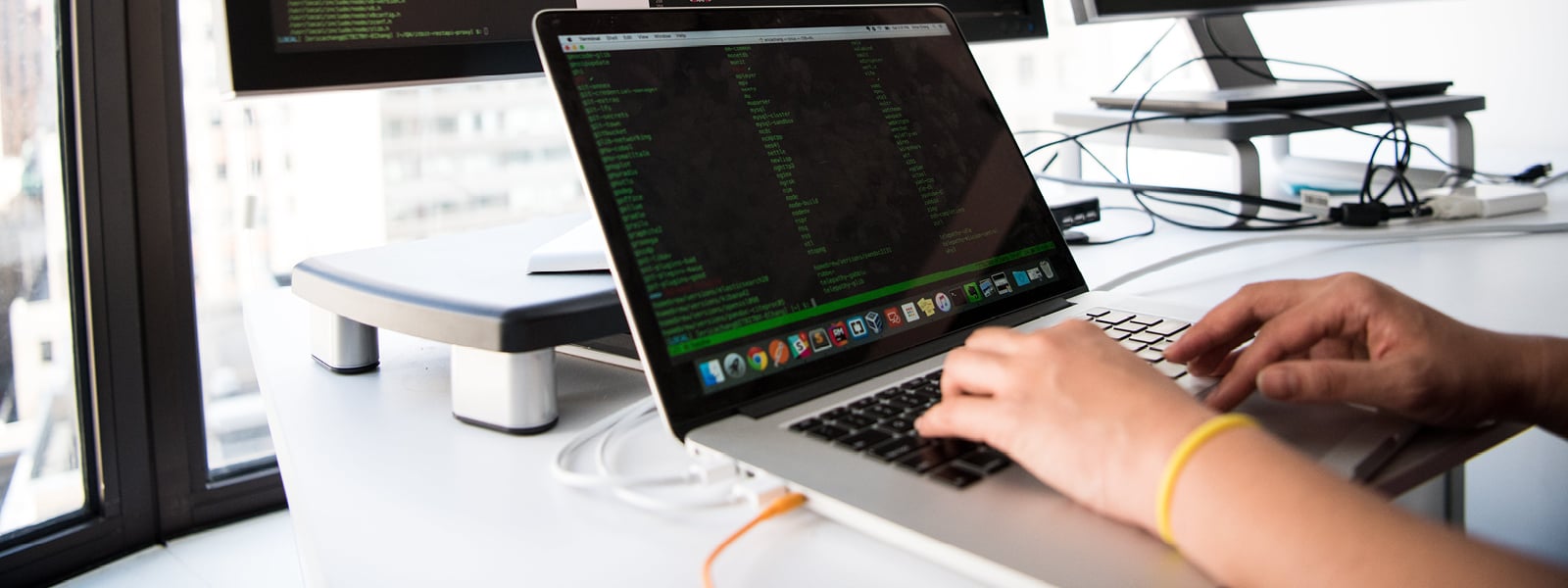 A person is typing on a laptop.