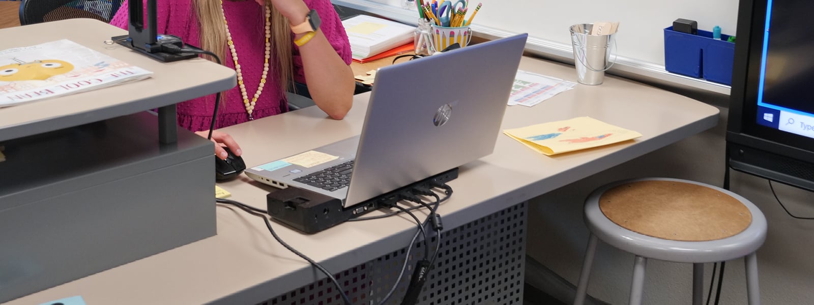 A student works on a laptop.